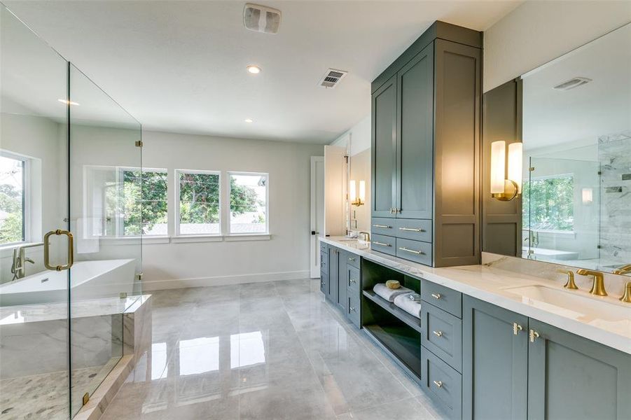 Bathroom with vanity, tile patterned flooring, and separate shower and tub