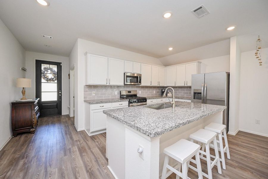 Stainless steel appliances —all sleek and modern, reinforcing the kitchen’s high-function appeal. Stainless steel appliances —all sleek and modern, reinforcing the kitchen’s high-function appeal.