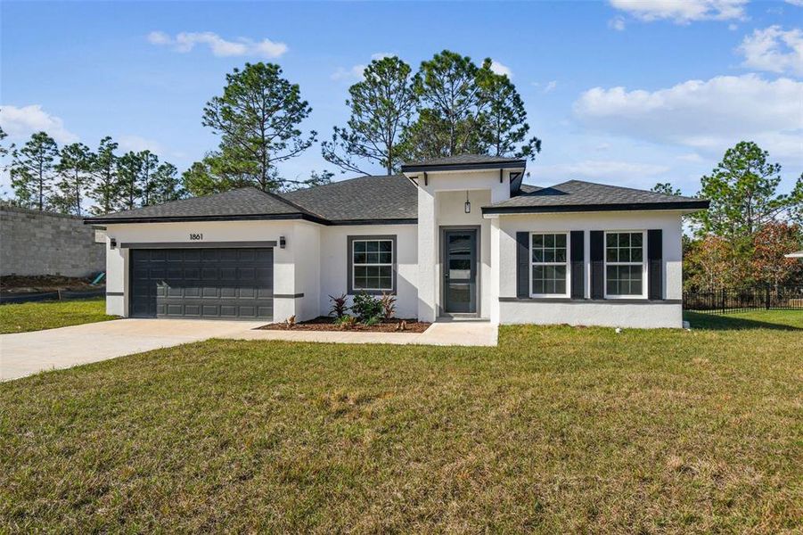 Front exterior of a new home in , Citrus Springs, FL, highlighting curb appeal (Image 2). Front exterior of a new home in , Citrus Springs, FL, highlighting curb appeal (Image 2).