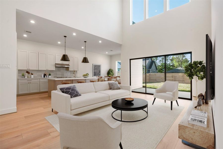 As you walk in, the first floor boasts an open-concept layout with soaring ceilings, abundant natural light, and a beautifully designed kitchen featuring high-end finishes and a spacious walk-in pantry. Virtually staged. As you walk in, the first floor boasts an open-concept layout with soaring ceilings, abundant natural light, and a beautifully designed kitchen featuring high-end finishes and a spacious walk-in pantry. Virtually staged.