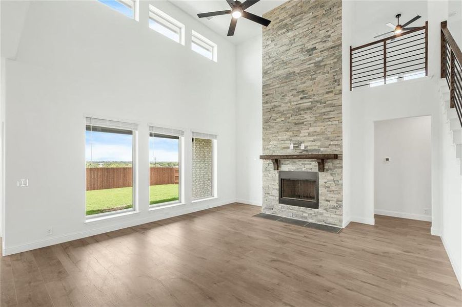 The Wall of Windows lets in an abundance of Natural Light. Don't you just love the Transom Windows at the top!