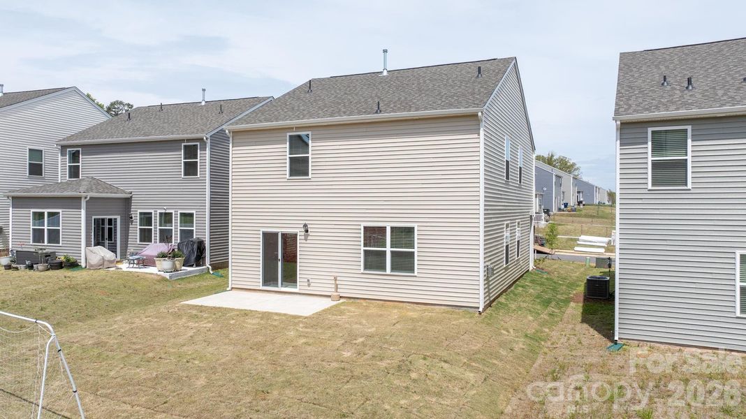 Exterior details and patio area of a home in The Hamptons at Hickory, Hickory (Image 3).