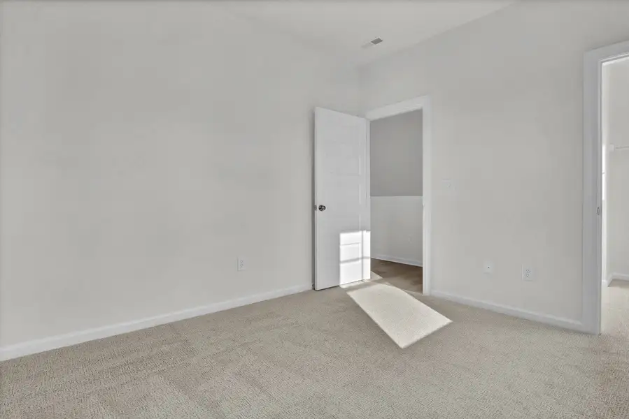 Spacious, unfurnished interior of a new home in Indigo at Abbey Preserve, Wilmington (Image 30).