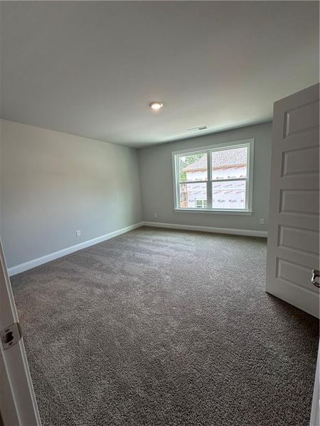 Spacious, unfurnished interior of a new home in Mirror Lake at South Harbour, Villa Rica (Image 37).