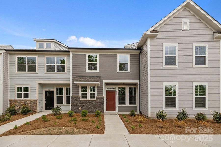 Front exterior of a new home in Greenway Overlook, Charlotte, NC, highlighting curb appeal (Image 1). Front exterior of a new home in Greenway Overlook, Charlotte, NC, highlighting curb appeal (Image 1).