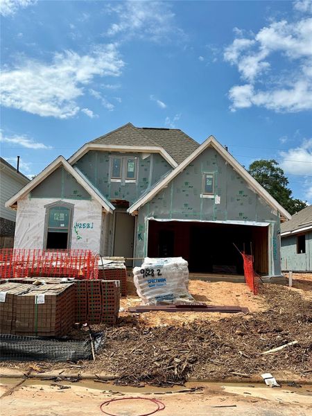 Front exterior of a new home in Escondido, Magnolia, TX, highlighting curb appeal (Image 8).