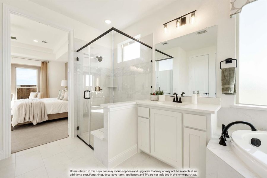 Master bathroom with glass walk-in shower, soaking tub, white vanity, and view into bedroom
