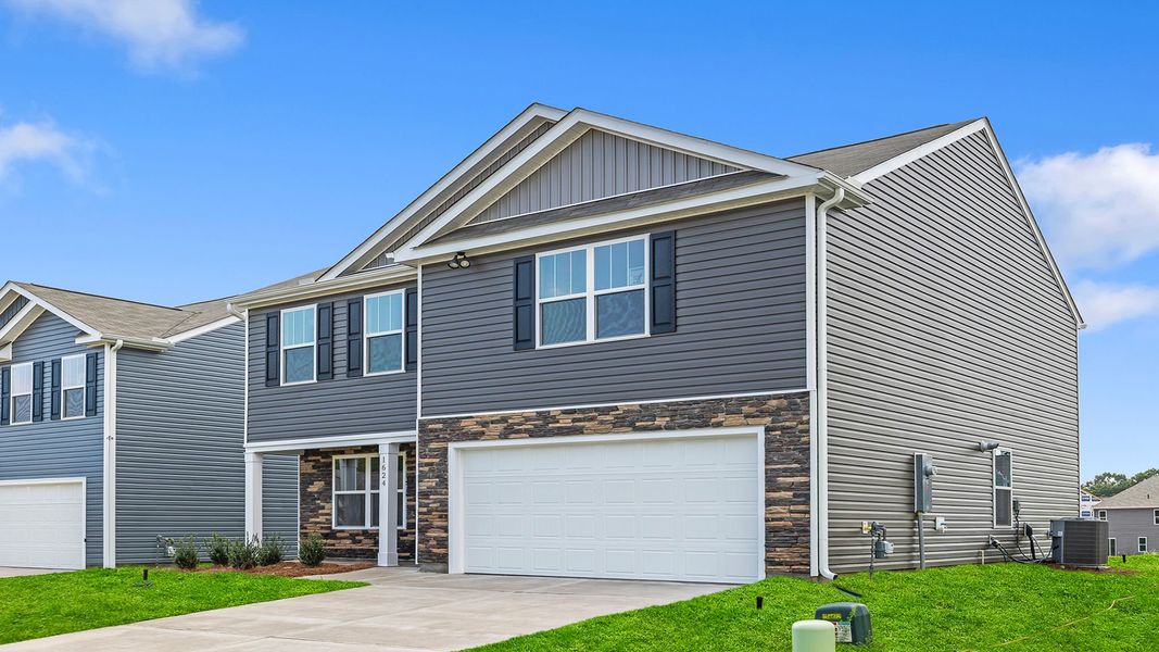 Front exterior of a new home in Lightwood Cottages, Moore, SC, highlighting curb appeal (Image 2).