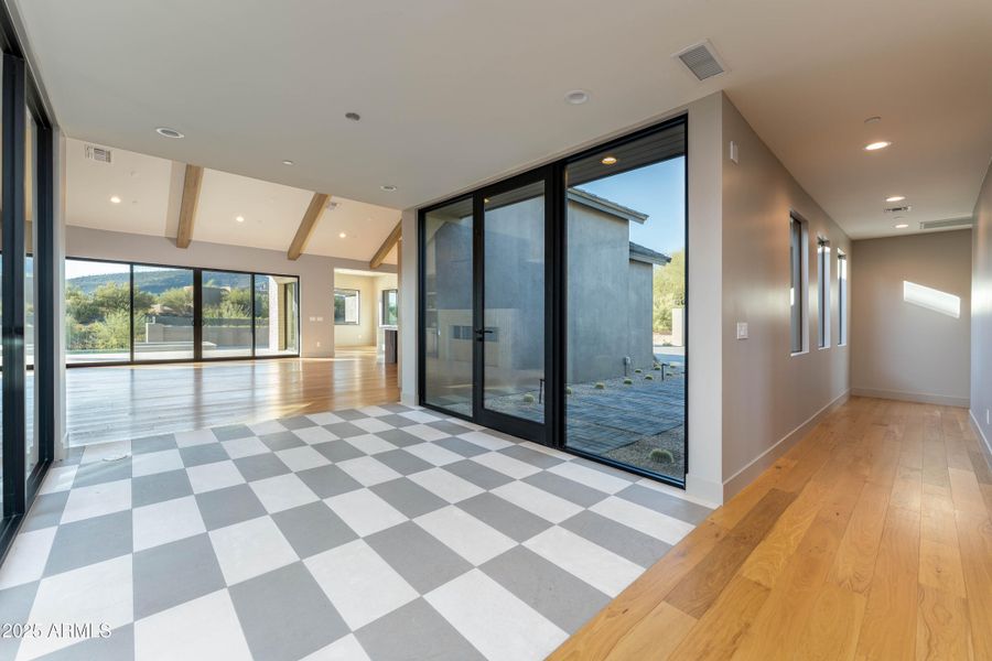 Front entry and hallway to guestrooms Front entry and hallway to guestrooms