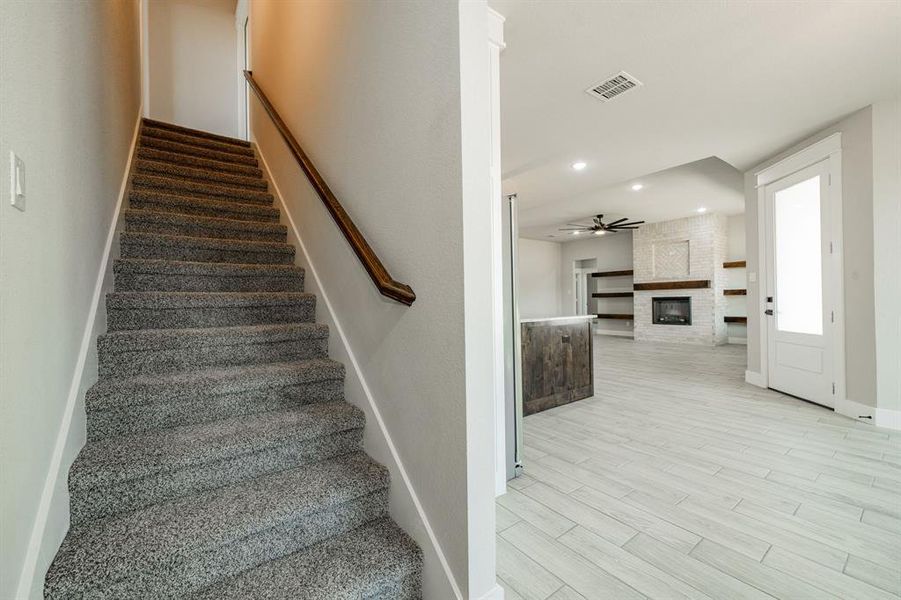 Carpeted stairway to the upstairs loft Carpeted stairway to the upstairs loft