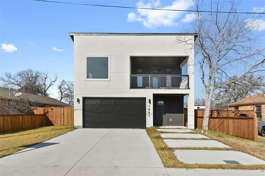 Contemporary house with a garage and a balcony