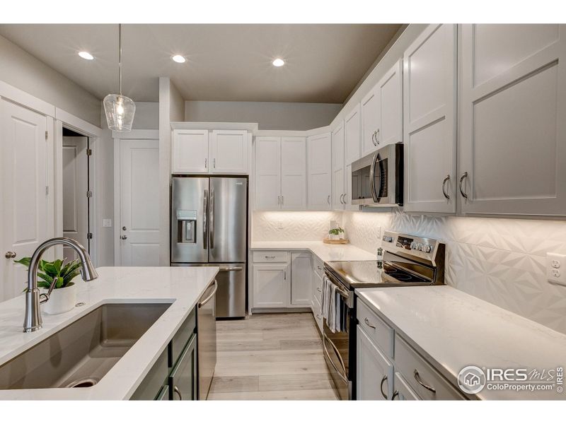 Furnished interior view inside a new home in Highlands at Fox Hill - The Towns, Longmont (Image 13).