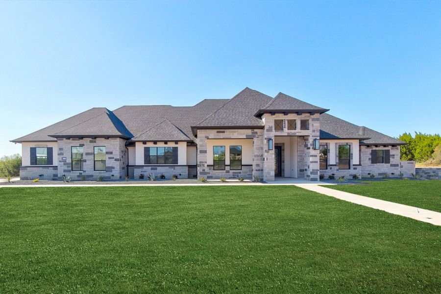 Front exterior of a home in the Pecan Plantation community, located in Granbury, TX (Image 13). Front exterior of a home in the Pecan Plantation community, located in Granbury, TX (Image 13).