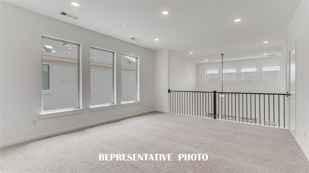 A light filled game room spacious enough to entertain a crowd!  REPRESENTATIVE PHOTO.