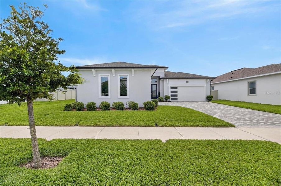 Front exterior of a new home in Robin's Cove at Epperson, Wesley Chapel, FL, highlighting curb appeal (Image 28).