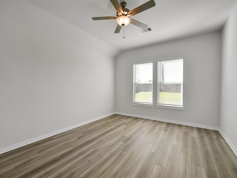 Spacious, unfurnished interior of a new home in Sunterra, Katy (Image 33).