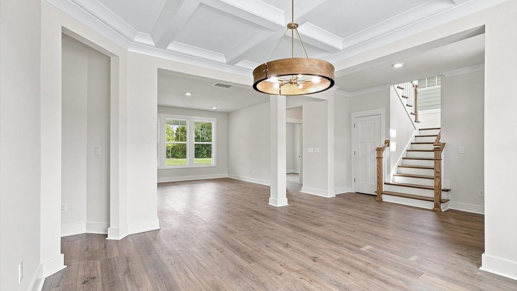 Superior craftsmanship seen in every corner—especially the coffered ceiling of this elegant dining space