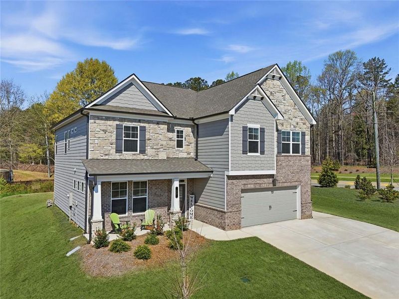 Front exterior of a new home in Rosewood Lake Estates, Hoschton, GA, highlighting curb appeal (Image 29). Front exterior of a new home in Rosewood Lake Estates, Hoschton, GA, highlighting curb appeal (Image 29).