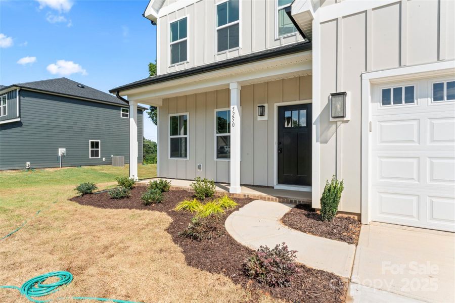 Front exterior of a new home in , Harrisburg, NC, highlighting curb appeal (Image 18).