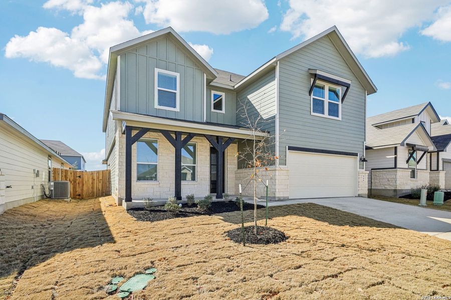 Front exterior of a new home in Estancia Ranch - Classic Series, San Antonio, TX, highlighting curb appeal (Image 1). Front exterior of a new home in Estancia Ranch - Classic Series, San Antonio, TX, highlighting curb appeal (Image 1).