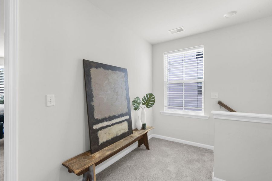 Furnished interior view inside a new home in Sweetgrass at Summers Corner, Summerville (Image 48).