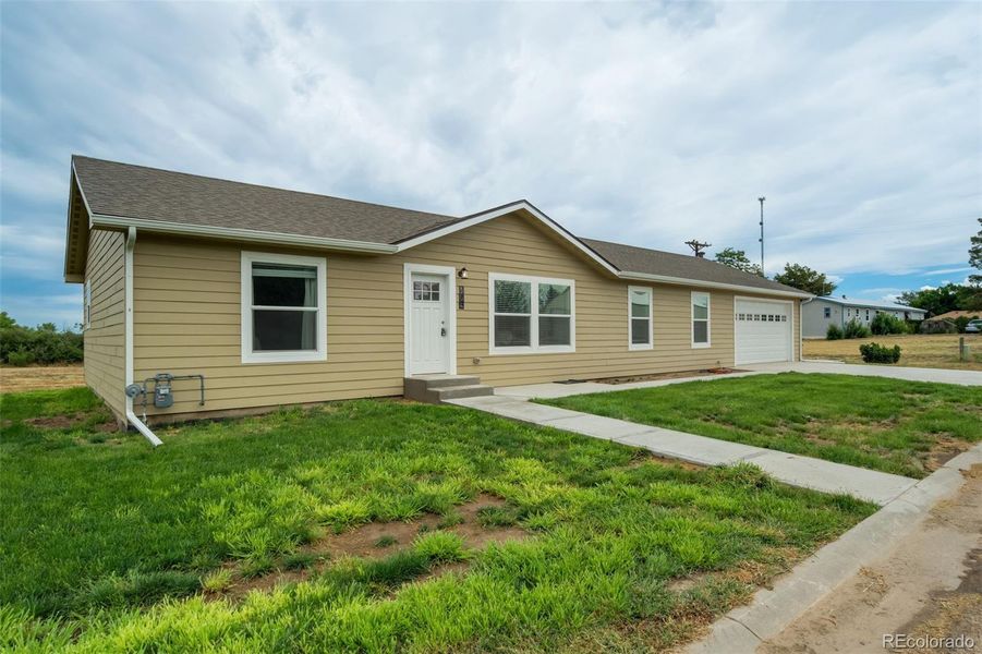 Front exterior of a new home in , Flagler, CO, highlighting curb appeal (Image 24). Front exterior of a new home in , Flagler, CO, highlighting curb appeal (Image 24).