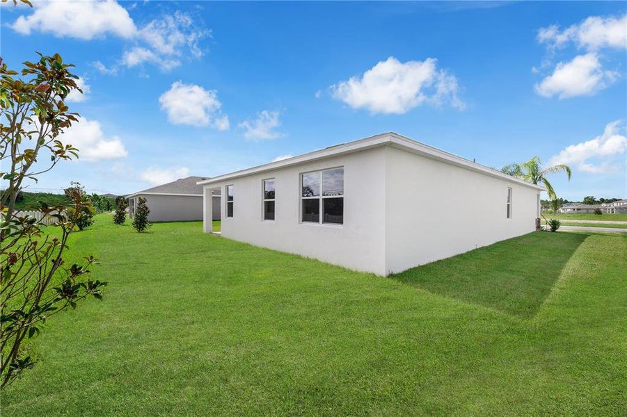 Exterior details and patio area of a home in Green Leaf, West Melbourne (Image 3).