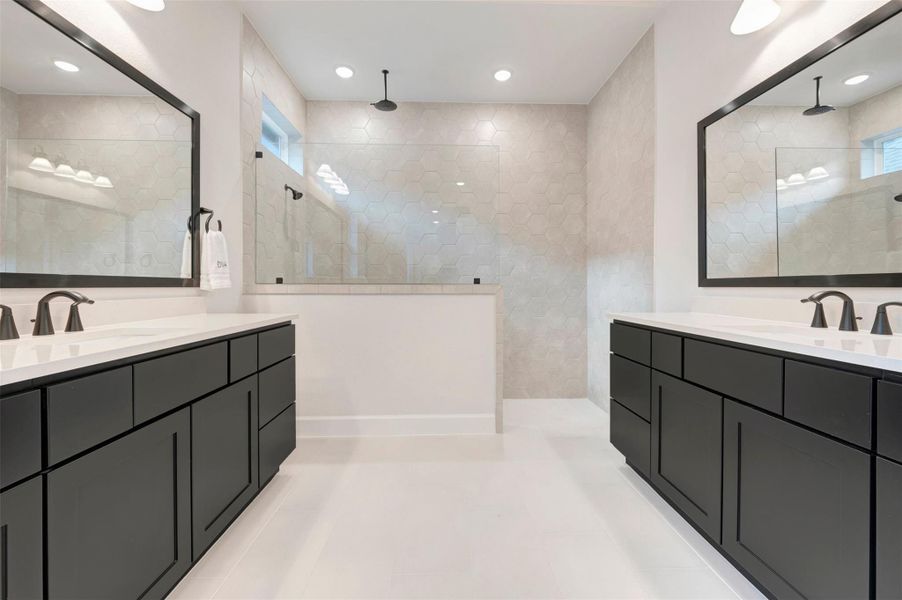 Dual vanities are a compliment to this bath with large walk in shower with 2 shower heads!