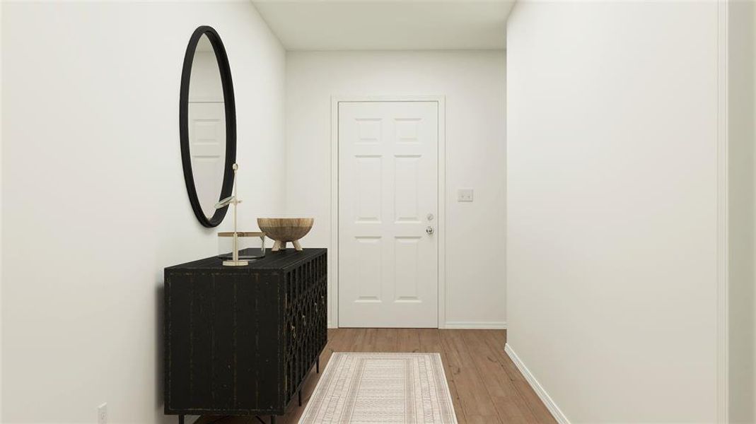 Corridor with light wood-style flooring and baseboards Corridor with light wood-style flooring and baseboards
