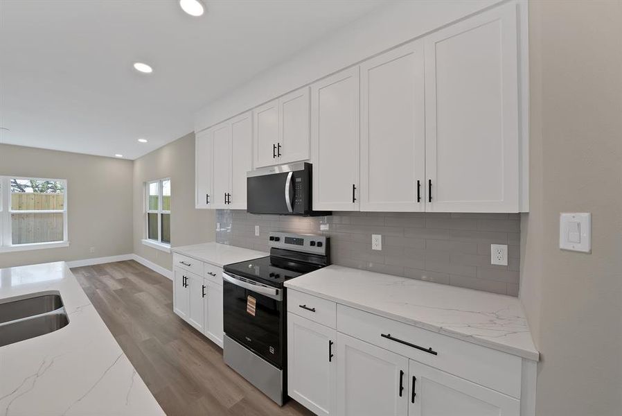 Furnished interior view inside a new home in , The Colony (Image 11).