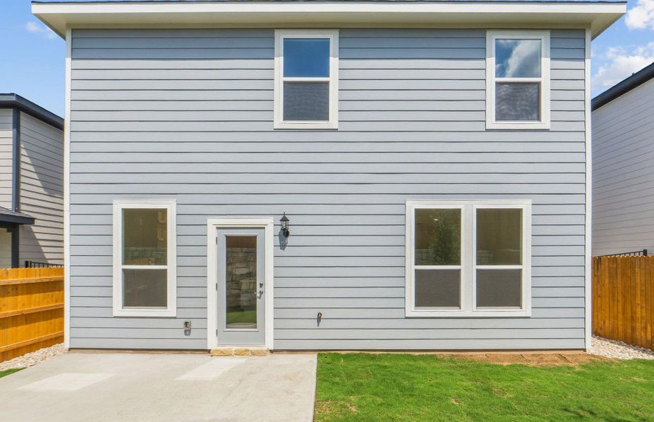 Exterior details and patio area of a home in Cameron Place, Manor (Image 3).