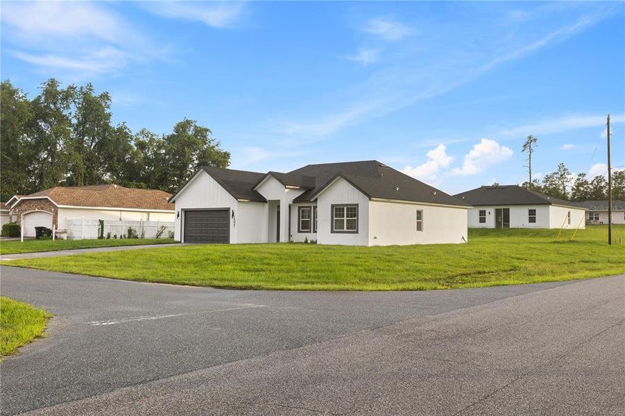Front exterior of a new home in , Ocala, FL, highlighting curb appeal (Image 24).