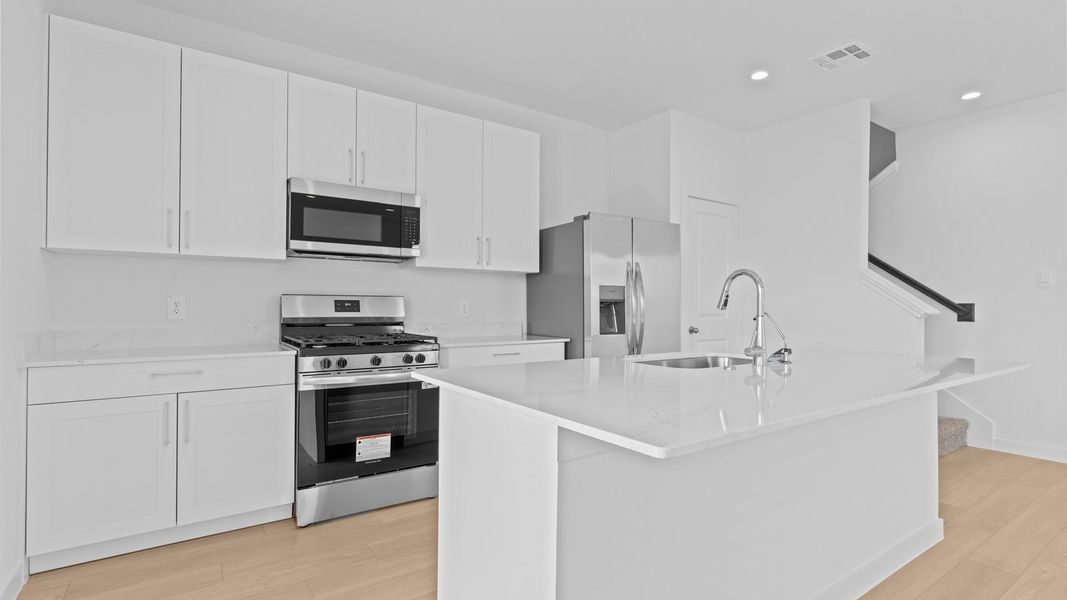 Furnished interior view inside a new home in Lexington Village, Missouri City (Image 9).