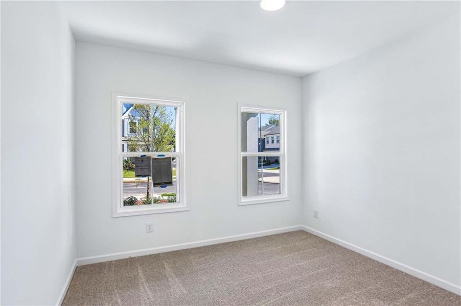Spacious, unfurnished interior of a new home in Eastlyn Crossing, Flowery Branch (Image 21).