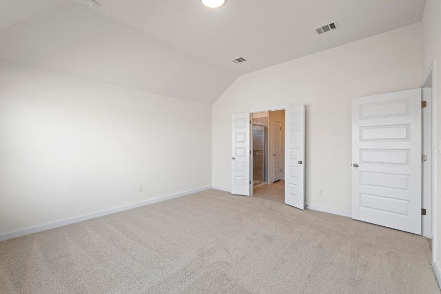 Primary Suite in the Quartz home plan by Trophy Signature Homes – REPRESENTATIVE PHOTO