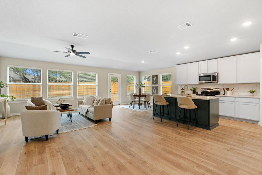 Open plan living room and kitchen with light oak flooring Open plan living room and kitchen with light oak flooring