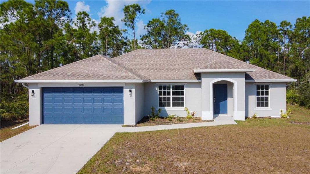 Front exterior of a new home in , Punta Gorda, FL, highlighting curb appeal (Image 23).