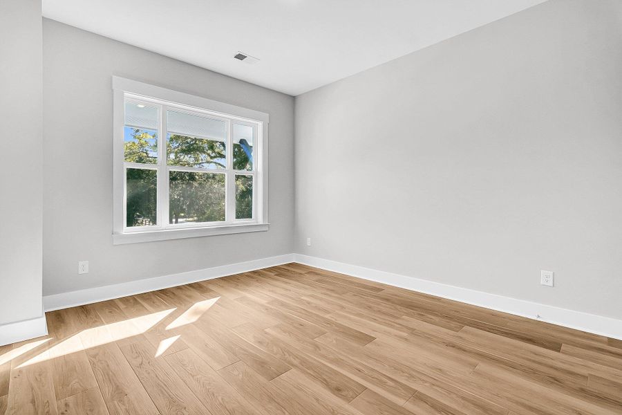 Spacious, unfurnished interior of a new home in Hidden Ponds Reserve, Awendaw (Image 30).