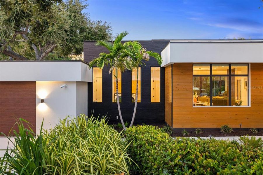 Front exterior of a new home in , Sarasota, FL, highlighting curb appeal (Image 23).