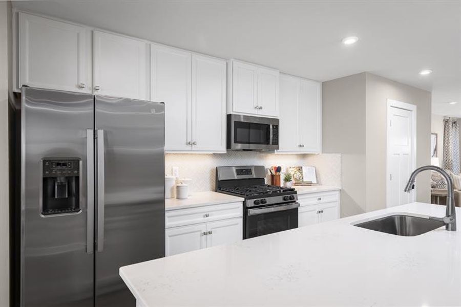 Representative furnished interior of a home built from the Nassau Cove Quick Move-In by Ryan Homes in Cobblestone at East Argent, Hardeeville (Image 3).