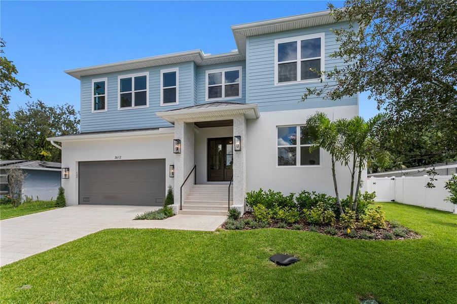 Front exterior of a new home in , Tampa, FL, highlighting curb appeal (Image 27).