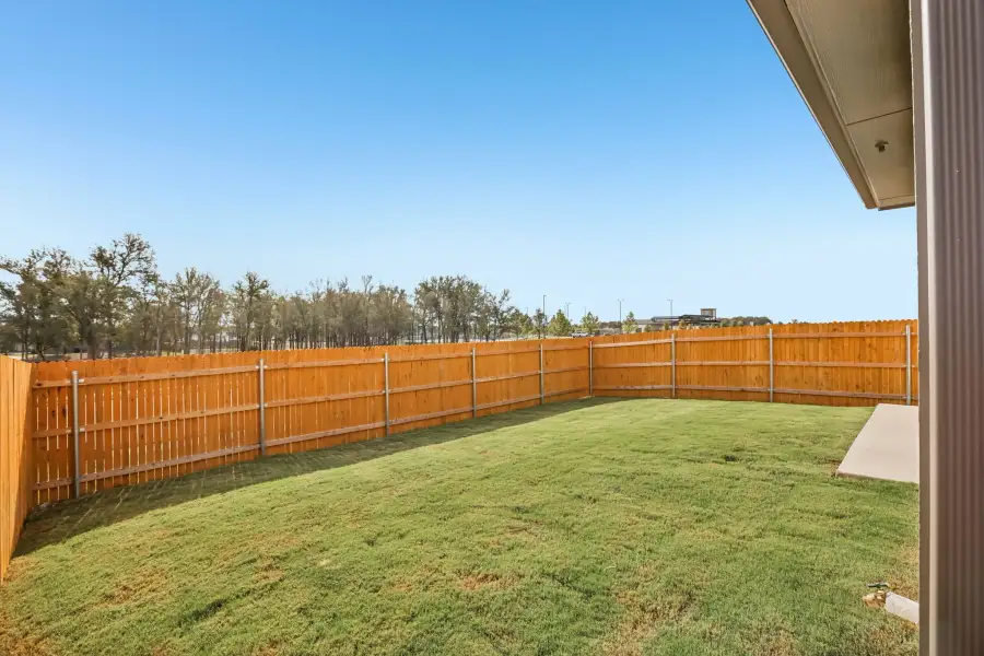 Exterior details and patio area of a home in Trinity Ranch, Elgin (Image 23).