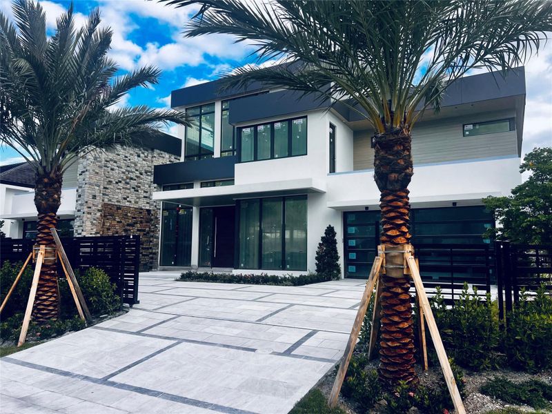 Front exterior of a new home in , Fort Lauderdale, FL, highlighting curb appeal (Image 1). Front exterior of a new home in , Fort Lauderdale, FL, highlighting curb appeal (Image 1).