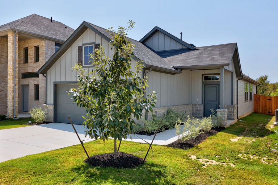 Front exterior of a new home in Trinity Ranch, Elgin, TX, highlighting curb appeal (Image 20).