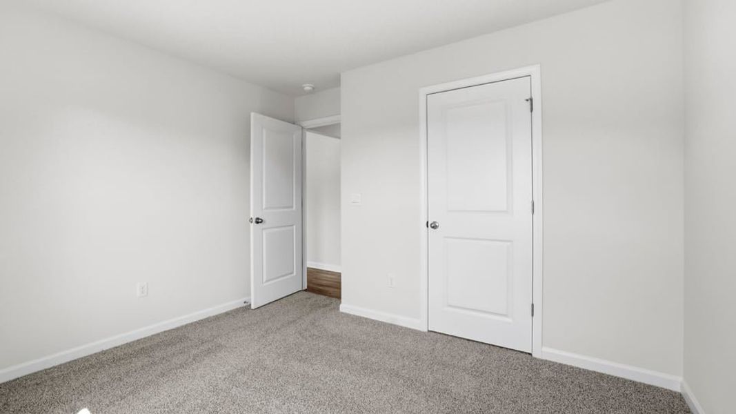 Spacious, unfurnished interior of a new home in Bentley Park, Greenwood (Image 23).