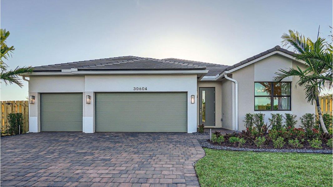 Front exterior of a new home in Estrella Square, Homestead, FL, highlighting curb appeal (Image 1). Front exterior of a new home in Estrella Square, Homestead, FL, highlighting curb appeal (Image 1).