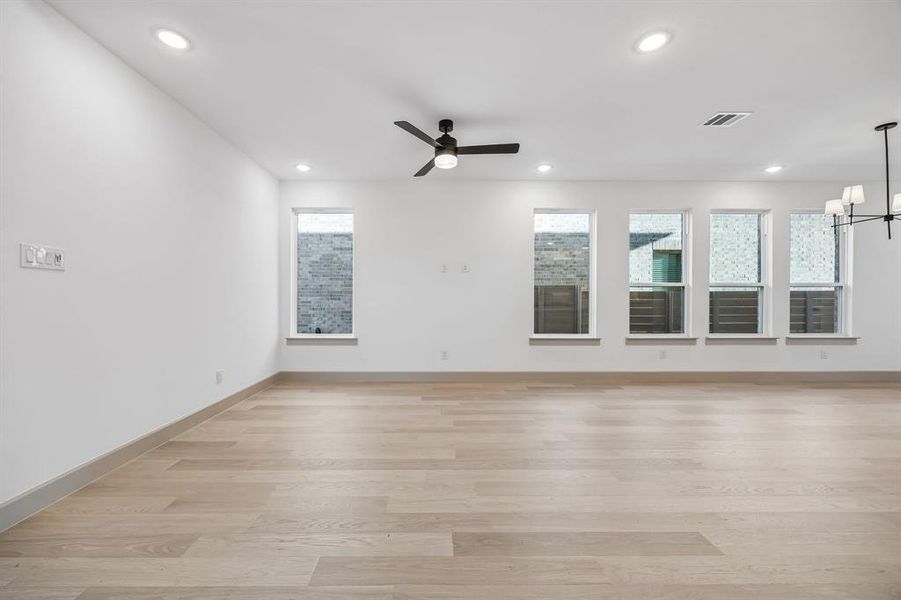 Your new family room offers lovely flooring with plenty of windows to fill the space with natural light.