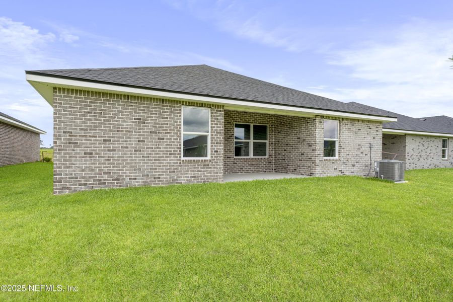 Front exterior of a new home in Shadow Crest at Rolling Hills, Green Cove Springs, FL, highlighting curb appeal (Image 13).