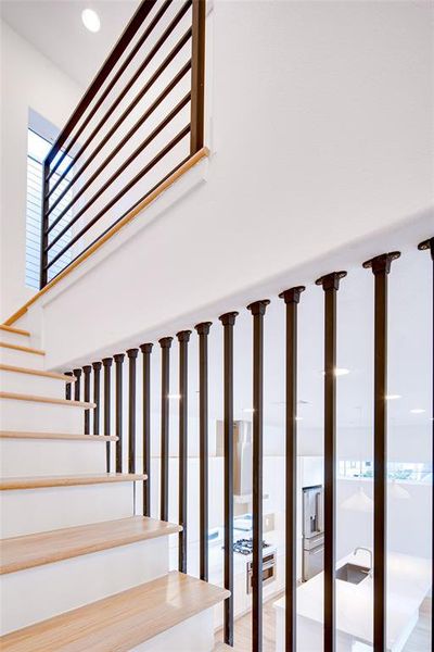 Stairs with hardwood / wood-style flooring