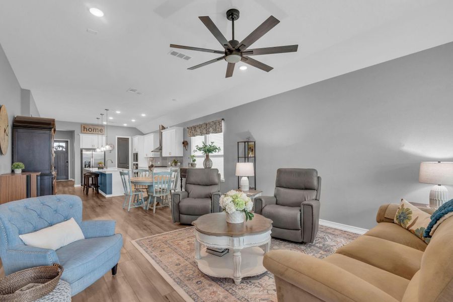 This angle shows the living room and open floor plan all the way through the kitchen. This angle shows the living room and open floor plan all the way through the kitchen.